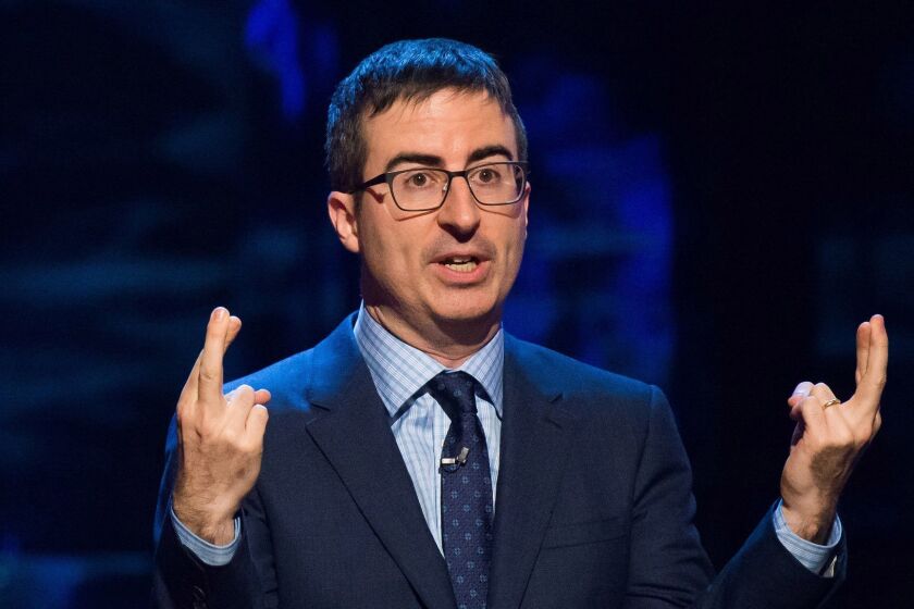 FILE - In this Feb. 28, 2015 file photo, John Oliver speaks at Comedy Central's "Night of Too Many Stars: America Comes Together for Autism Programs" in New York. Jon Stewart's 16-year-long run as host of "The Daily Show with Jon Stewart," has helped launch comedy careers. In April 2014, this droll Brit debuted his own weekly comic-commentary show, "Last Week Tonight," on HBO. (Photo by Charles Sykes/Invision/AP, File)