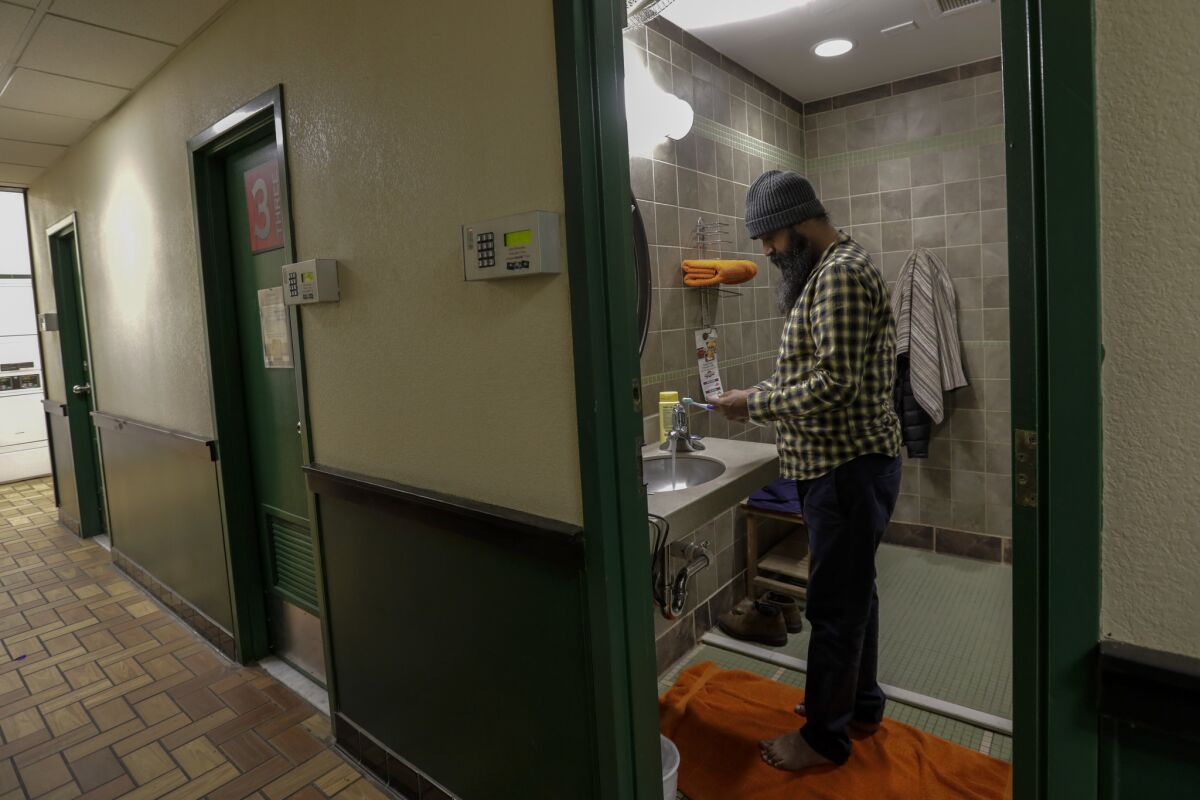 Singh prepares for shower at the Petro Stopping Center in Milan, N.M. (Irfan Khan / Los Angeles Times)