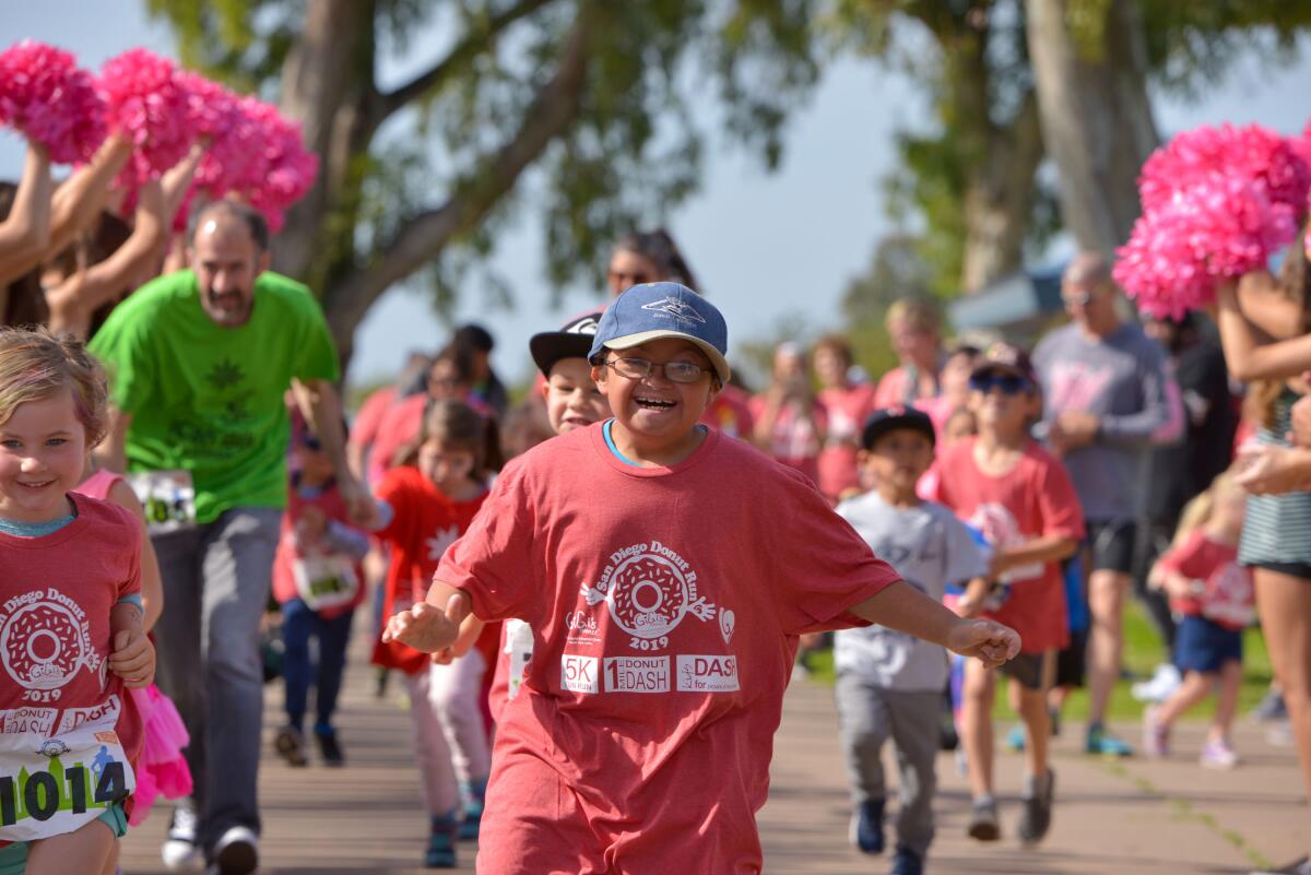 Participants run in GiGi's Playhouse San Diego's San Diego Donut Run 2019.