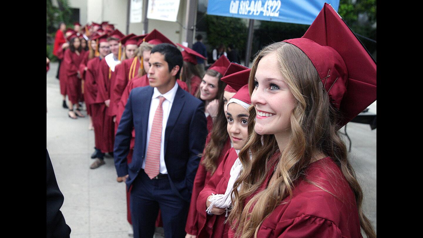 La Cañada High School senior Julia Harbolt, 17, attending Azusa Pacific University in the fall, smiles as the graduates are being organized at the annual interfaith baccalaureate service for graduating high school seniors at St. Bede the Venerable Catholic Church in La Cañada Flintridge on Tuesday, May 24, 2016. The service was sponsored by the La Cañada Flintridge Interfaith Ministerial Association.