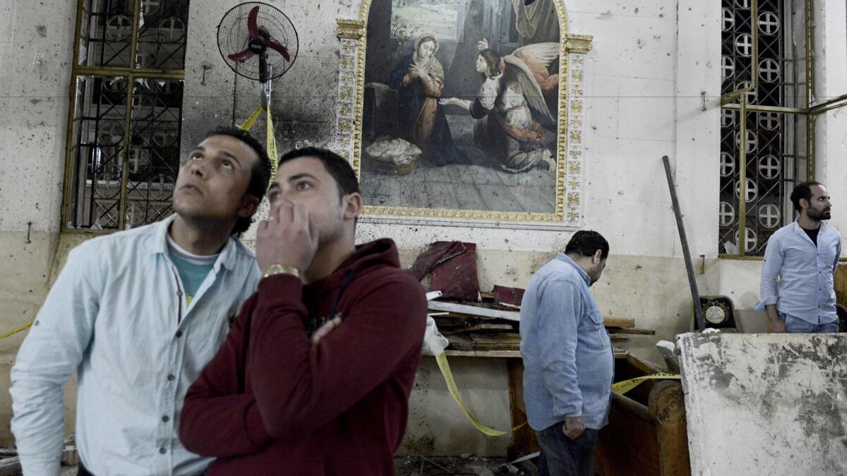 Friends and relatives of victims at St. George's Church in Tanta, Egypt, following the explosion.