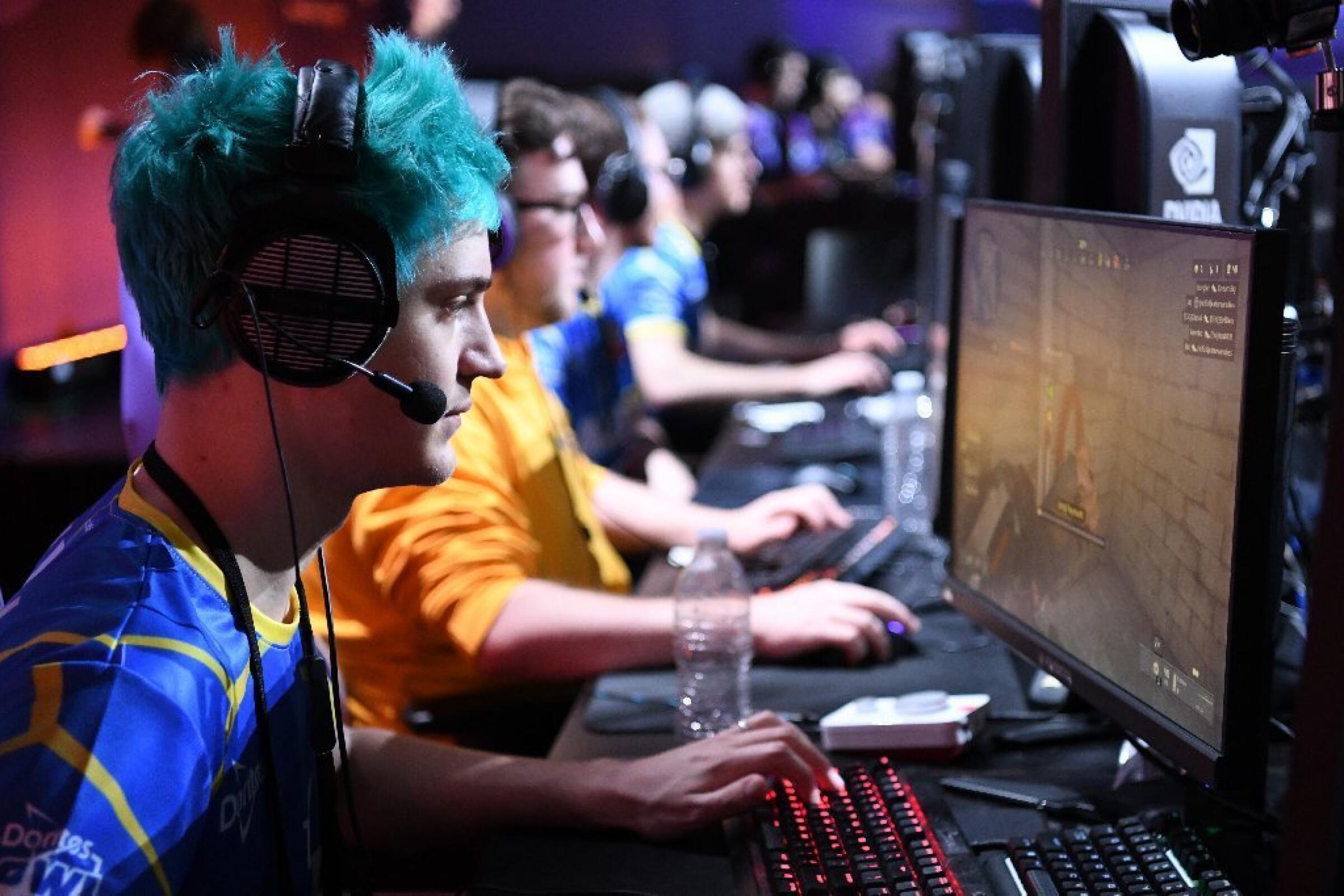 Tyler "Ninja" Blevins, one of Twitch's most popular gamers before moving platforms earlier this year, plays Call of Duty: Black Ops 4 during the Doritos Bowl 2018 at TwitchCon 2018.