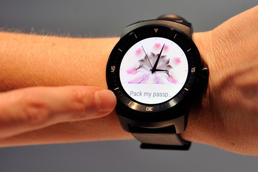 The LG G Watch R is shown during the 2015 International CES in January. Users say they enjoy the non-techie look of the watch because the device blends in as if it were a normal timepiece.