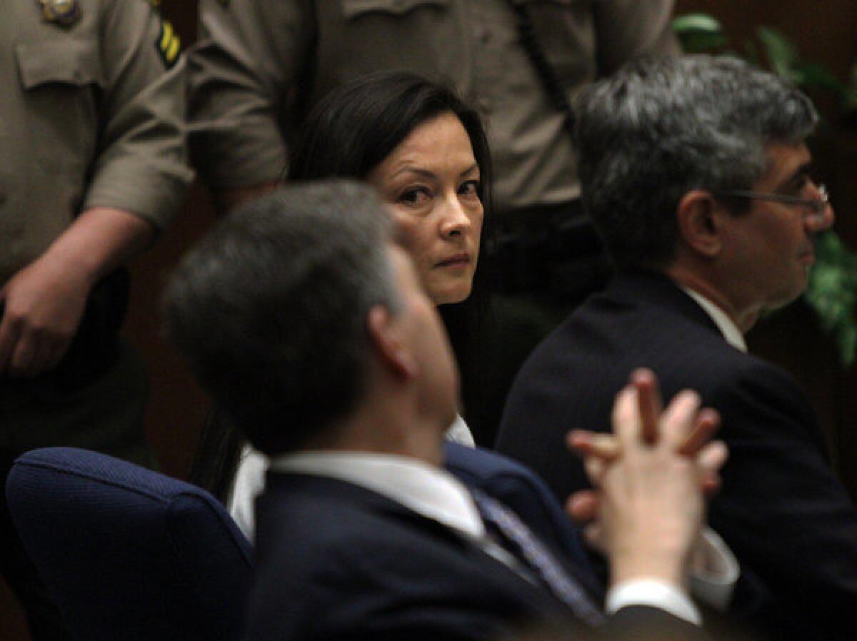 Kelly Soo Park glances at her lawyer George Buehler, left, during her murder trail.