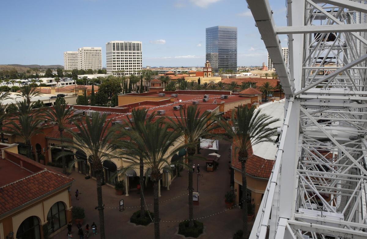 The Irvine Spectrum Center, viewed from the Ferris wheel, hosts its Endless Summer Festival on Saturday.