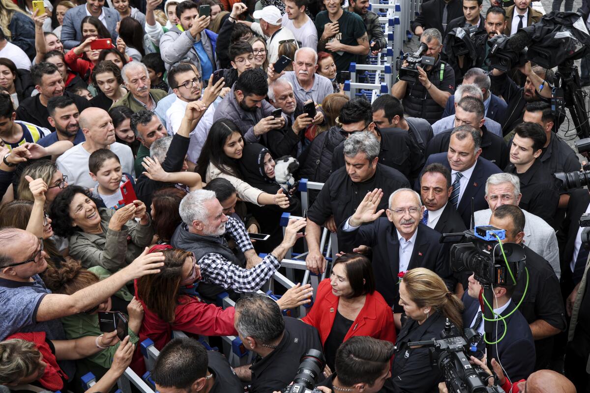 Opposition candidate Kemal Kilicdaroglu waves in a crowd.