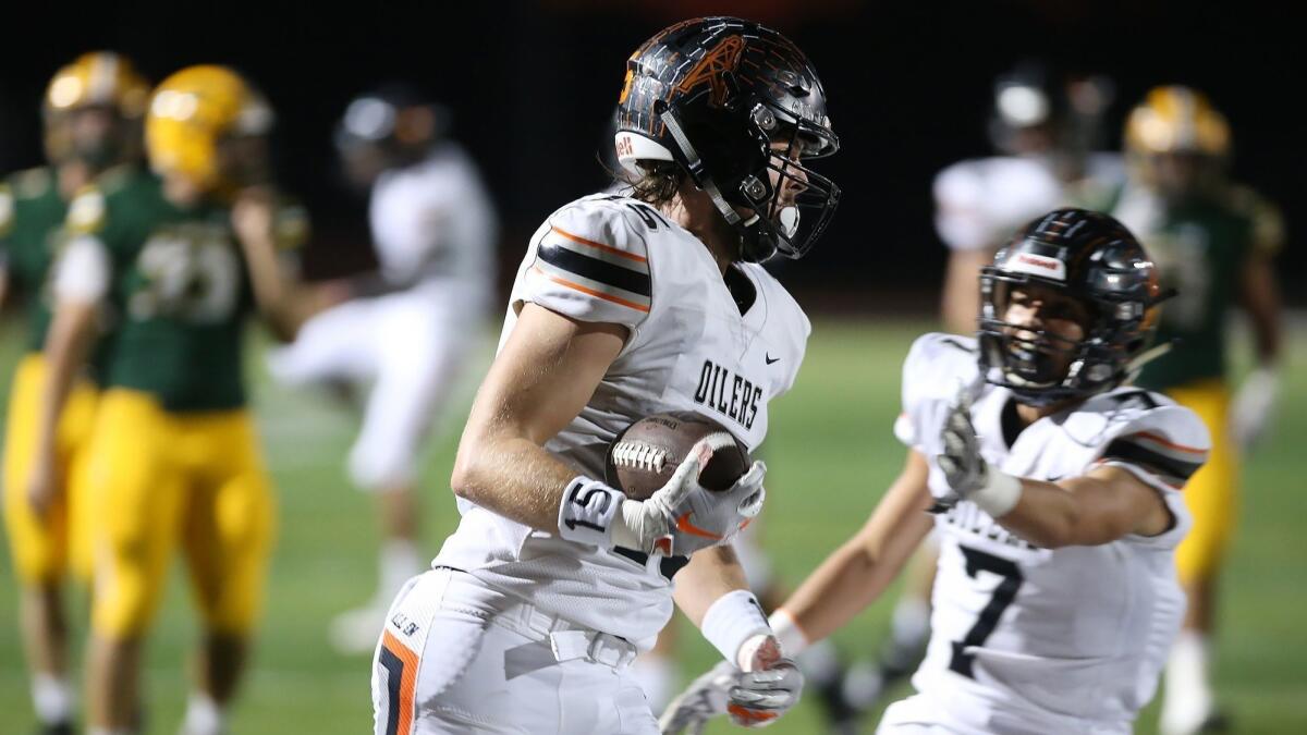 Huntington Beach senior tight end Christian Moore, shown scoring a touchdown against Edison on Oct. 5, 2018, is a key player for the Oilers.