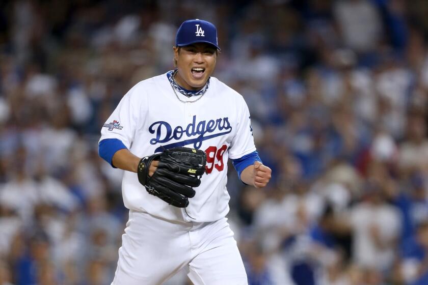Dodgers starter Hyun-Jin Ryu gets pumped up after a strikeout in the seventh inning of Game 3 of the NLCS.