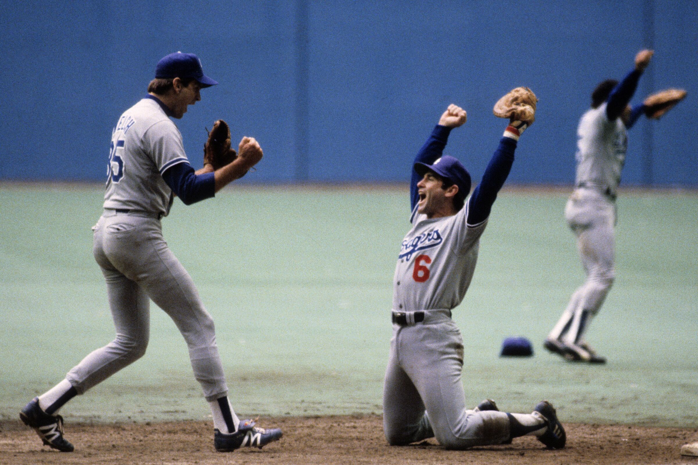 Dodgers Bob Welch, left, and Steve Garvey celebrate after a 2-1 win over the Montreal Expos.