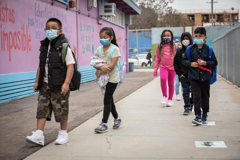 SAN DIEGO, CA - APRIL 12: Students head to class Monday morning at Perkins K-8 on their first day of school (Jarrod Valliere / The San Diego Union-Tribune)