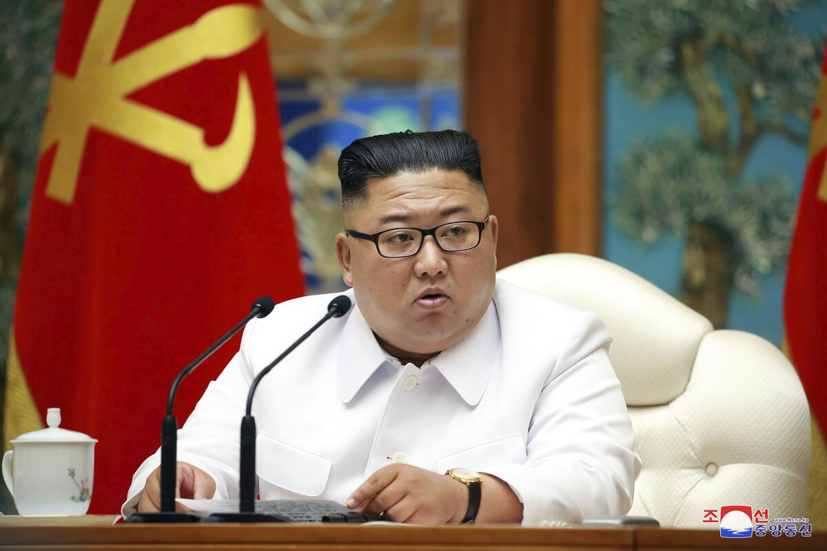 Kim Jong Un attends a meeting.