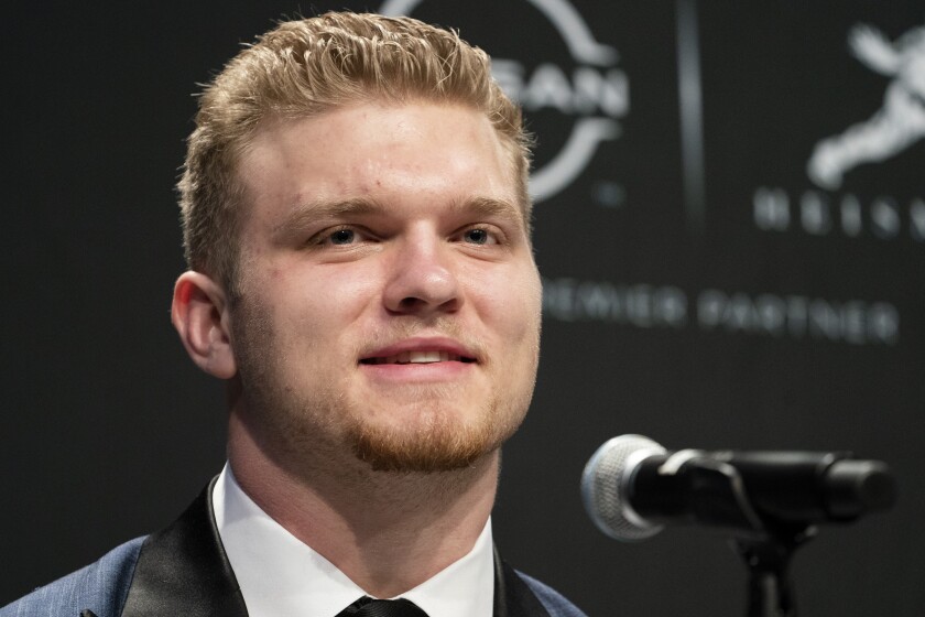 Heisman Trophy finalist Michigan defensive end Aidan Hutchinson speaks during a news conference before attending the Heisman Trophy award ceremony, Saturday, Dec. 11, 2021, in New York. (AP Photo/John Minchillo)