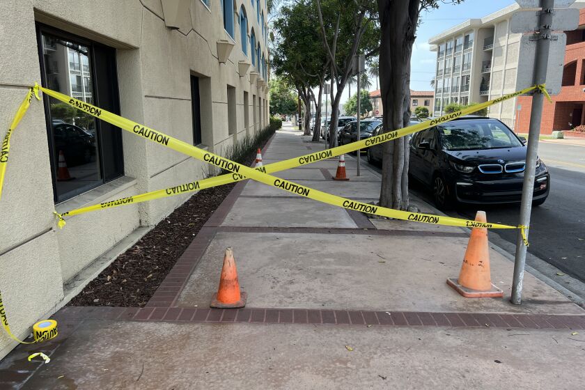 By way of a demonstration, Ed Witt set up caution tape and cones near where a 2020 alleged trip took place, in line with a reported city request.
