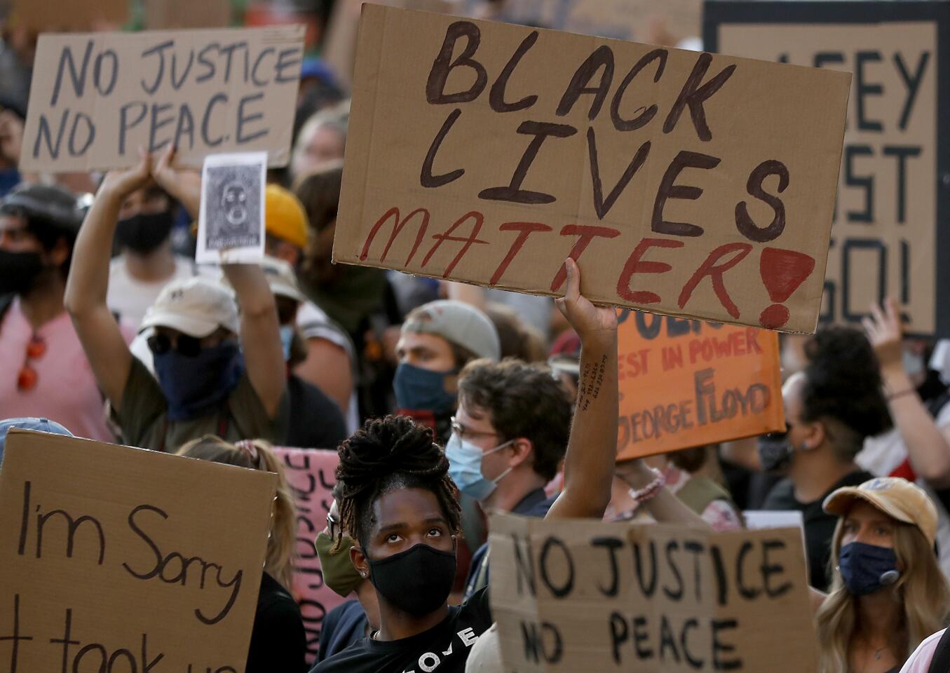 Thousands of protesters gather at the Los Angeles Civic Center to demonstrate in solidarity