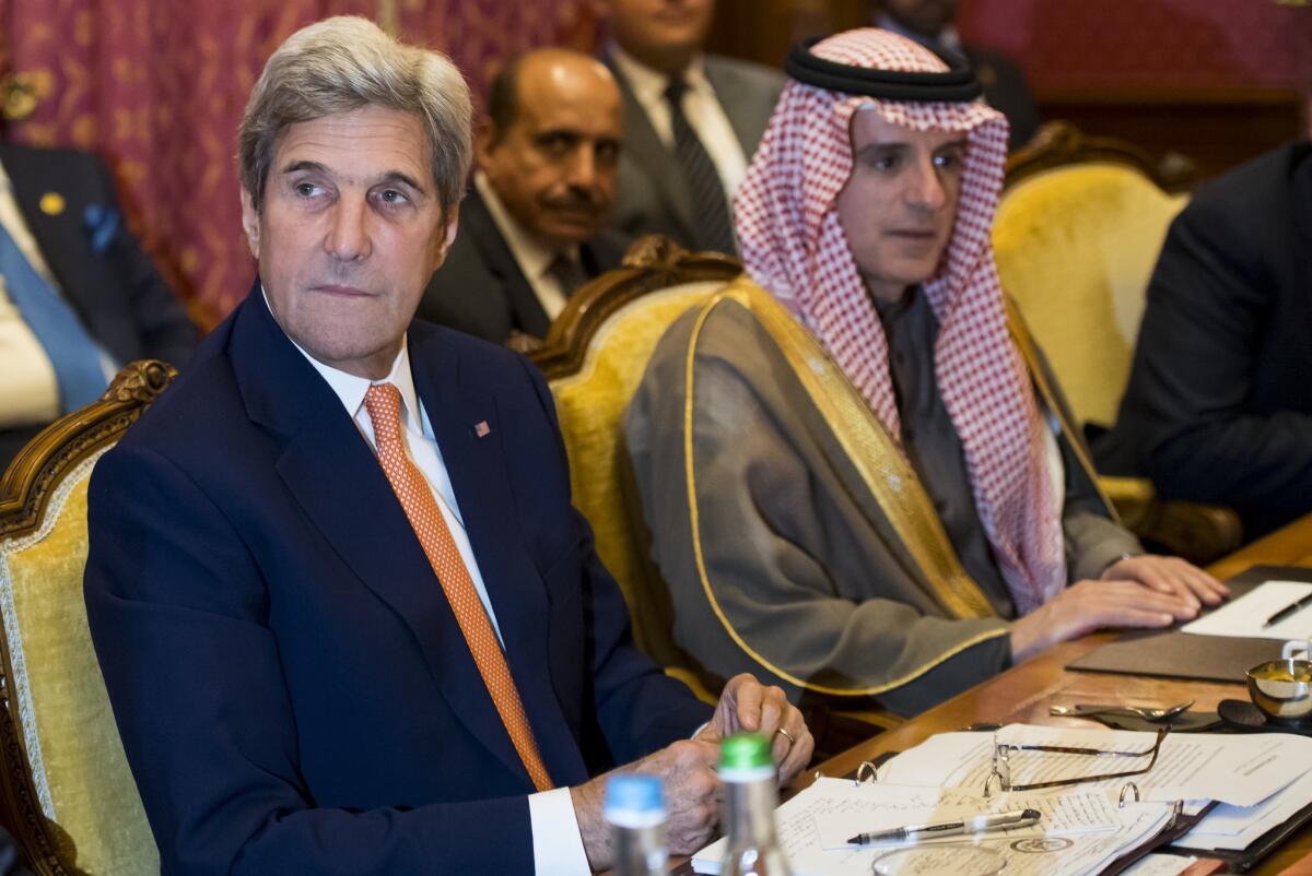 U.S. Secretary of State John Kerry, left, and Saudi Arabian Foreign Minister Adel Jubeir attend a meeting Saturday in Lausanne, Switzerland, where they discussed the crisis in Syria.