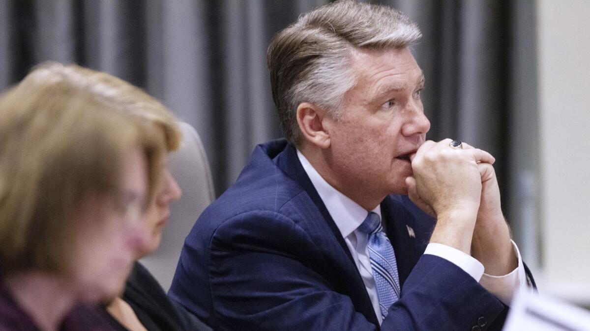 At the North Carolina State Bar in Raleigh, N.C., Mark Harris, Republican candidate in North Carolina's 9th Congressional District race, listens on Feb. 20, 2019, to testimony during the third day of a public evidentiary hearing on voting irregularities.