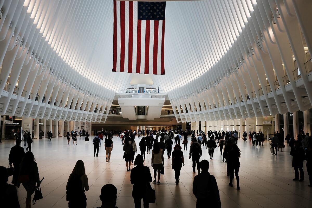NEW YORK, NY - SEPTEMBER 11: People walk through the Oculus located at the World Trade Center site during a morning commemoration ceremony for the victims of the terrorist attacks seventeen years after the day on September 11, 2018 in New York City. Throughout the country services are being held to remember the 2,977 people who were killed in New York, the Pentagon and in a field in rural Pennsylvania on what was one of the worst attacks on American soil in the nations history. (Photo by Spencer Platt/Getty Images)