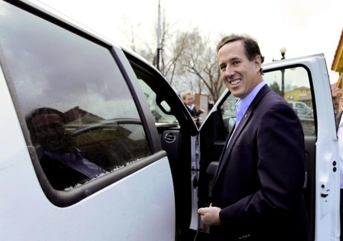 Rick Santorum leaves after a campaign stop in Colorado Springs, Colo.