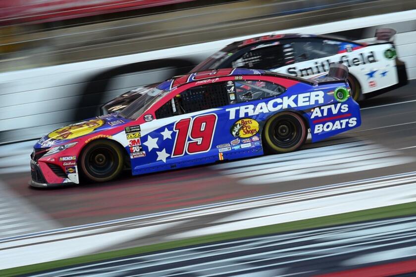 CHARLOTTE, NORTH CAROLINA - MAY 26: Martin Truex Jr., driver of the #19 Bass Pro Shops/TRACKER/USO Toyota, leads Aric Almirola, driver of the #10 Smithfield Ford, during the Monster Energy NASCAR Cup Series Coca-Cola 600 at Charlotte Motor Speedway on May 26, 2019 in Charlotte, North Carolina. (Photo by Jared C. Tilton/Getty Images) ** OUTS - ELSENT, FPG, CM - OUTS * NM, PH, VA if sourced by CT, LA or MoD **