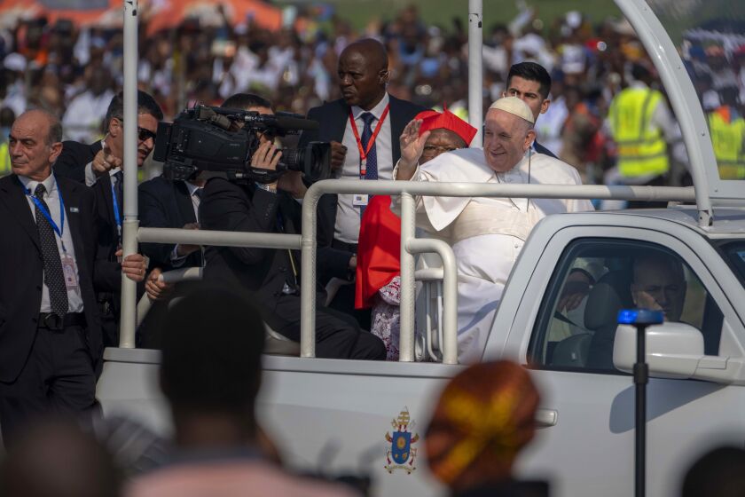 Pope Francis arrives at Ndolo airport to celebrate Holy Mass in Kinshasa, Congo, Wednesday Feb. 1, 2023. Local climate activists in Congo are hoping Pope Francis' visit will help spur action to protect the country's rainforest from oil and gas interests. (AP Photo/Jerome Delay)