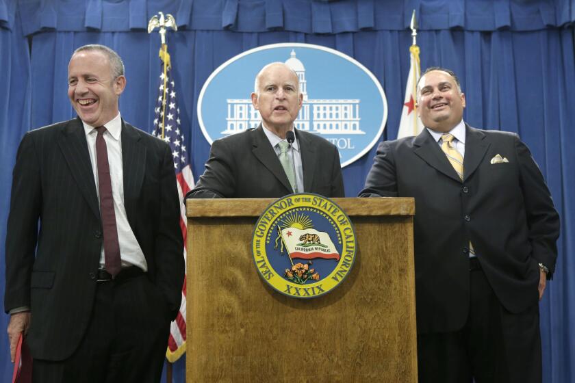 Senate leader Darrell Steinberg (D-Sacramento), Gov. Jerry Brown and Assembly Speaker John A. Perez (D-Los Angeles) at a press conference in the Capitol on Tuesday.