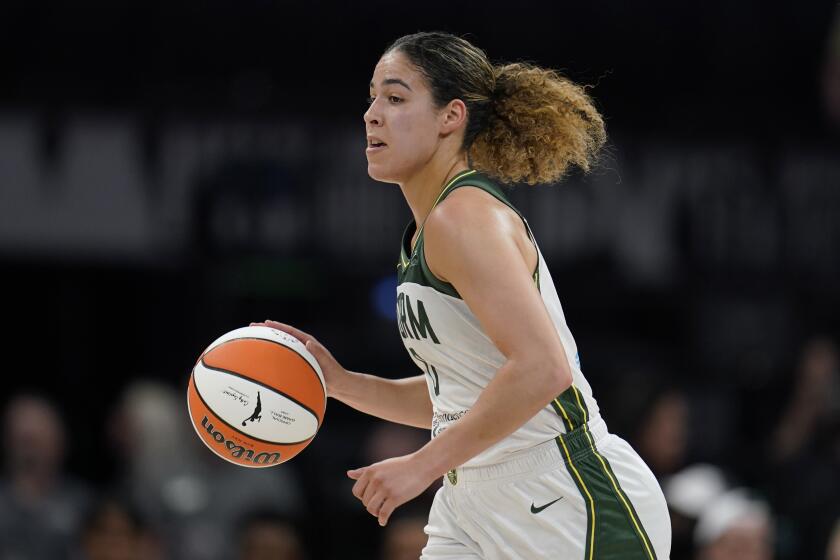 Seattle Storm guard Kia Nurse dribbles down the court during the first half of a WNBA basketball game against the Minnesota Lynx, Tuesday, June 27, 2023, in Minneapolis. (AP Photo/Abbie Parr)