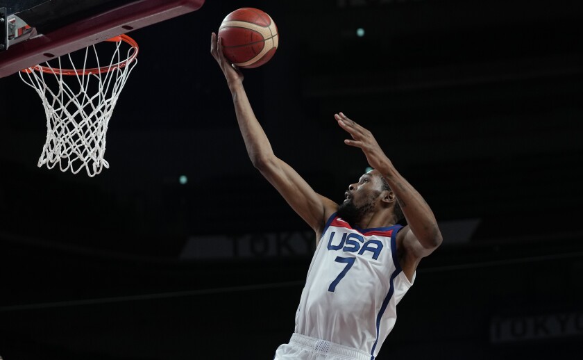 United States' Kevin Durant (7) scores during men's basketball gold medal game against France at the 2020 Summer Olympics, Saturday, Aug. 7, 2021, in Saitama, Japan. (AP Photo/Eric Gay)
