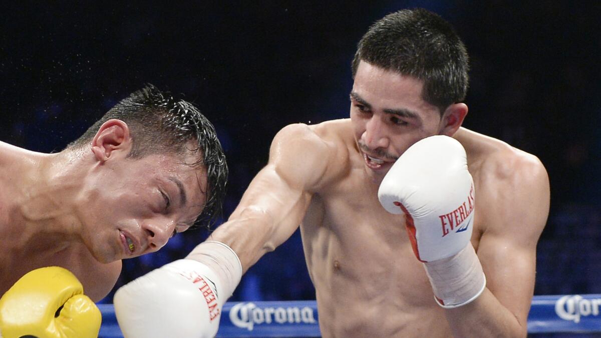 Leo Santa Cruz, right, throws a punch during his WBC super bantamweight title victory over Cristian Mijares in Las Vegas in March 2014.
