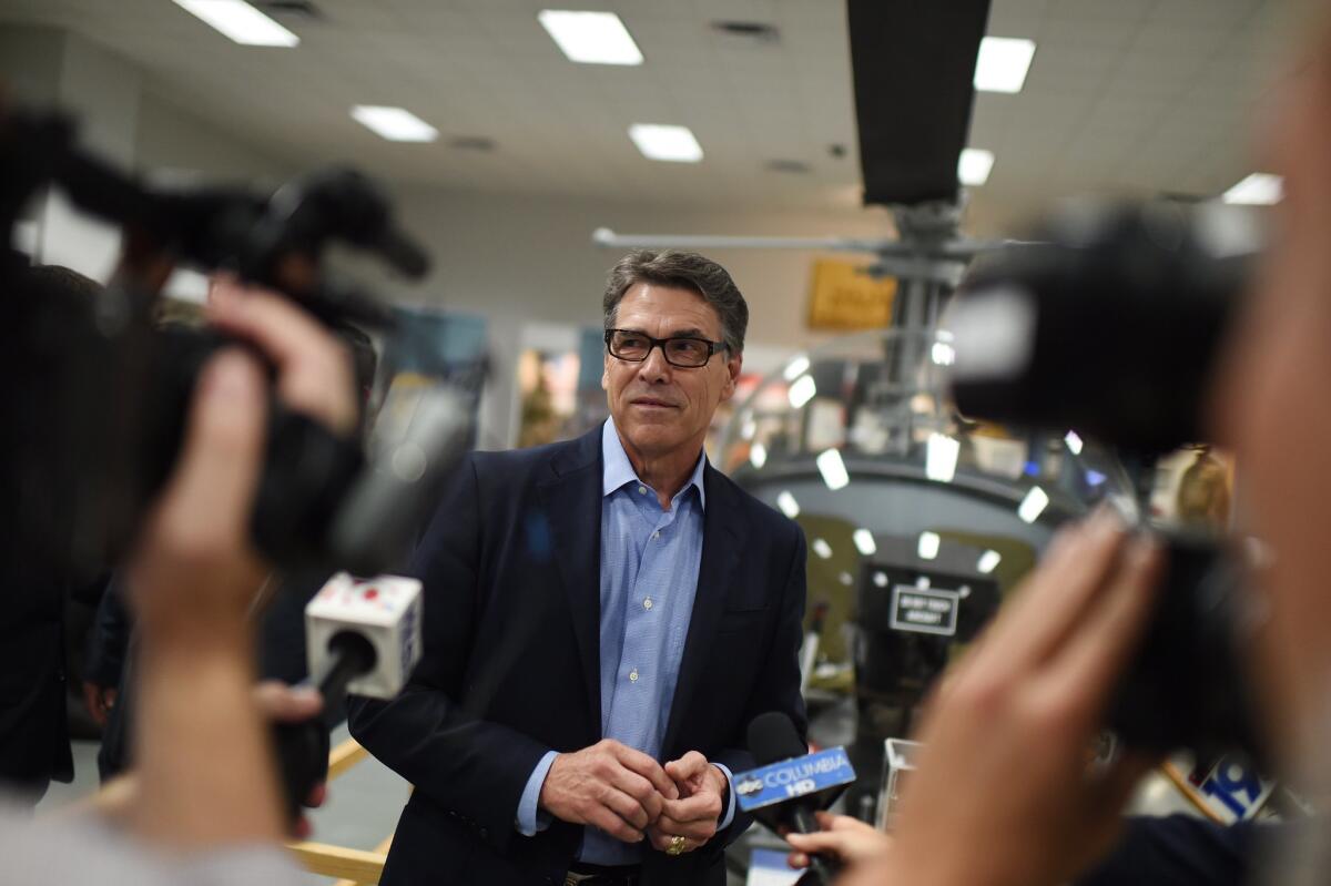 Republican presidential candidate and former Texas Gov. Rick Perry speaks to the media during a campaign stop at the South Carolina Military Museum on June 8 in Columbia, S.C.