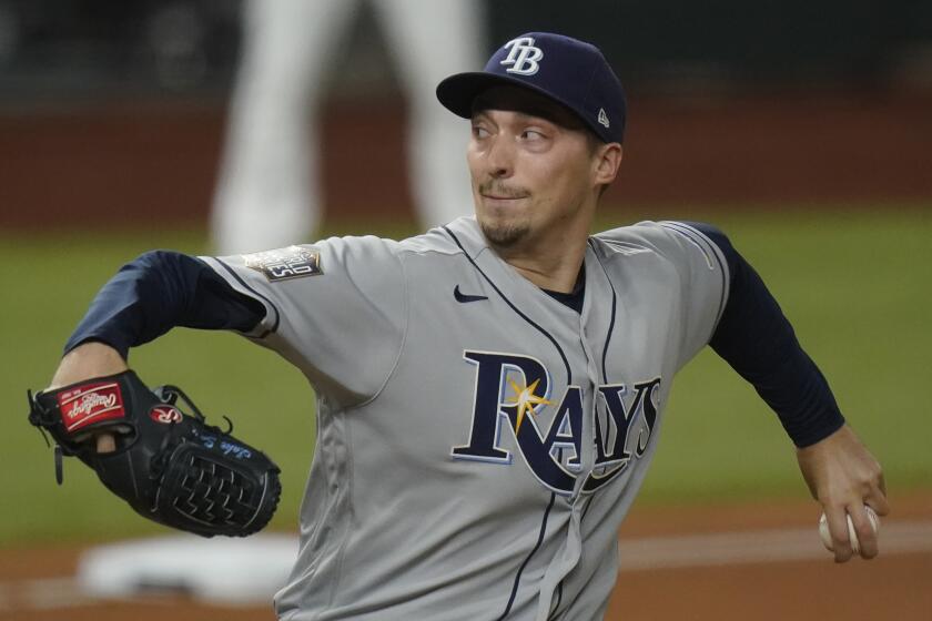 Tampa Bay Rays starting pitcher Blake Snell throws against the Los Angeles Dodgers during the first inning in Game 2 of the baseball World Series Wednesday, Oct. 21, 2020, in Arlington, Texas. (AP Photo/Eric Gay)