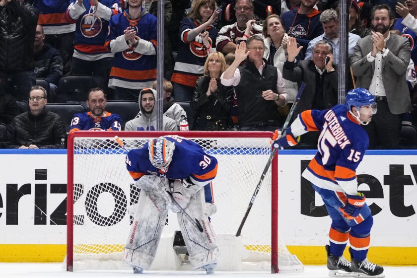 New York Islanders' Cal Clutterbuck (15) skates past goaltender Ilya Sorokin (30) after scoring a goal during the second period of an NHL hockey game against the Toronto Maple Leafs Tuesday, March 21, 2023, in Elmont, N.Y. (AP Photo/Frank Franklin II)
