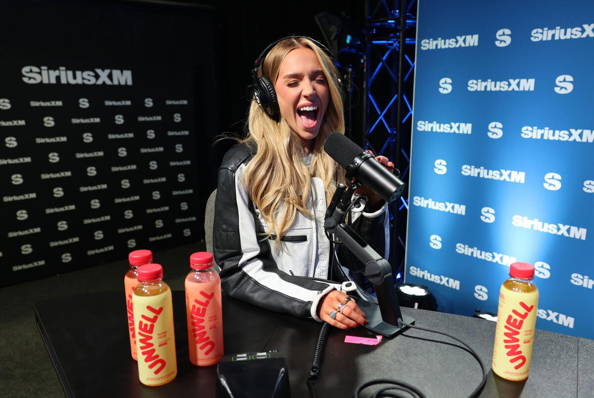 Alex Cooper speaks on SiriusXM with Unwell beverages in New Orleans.