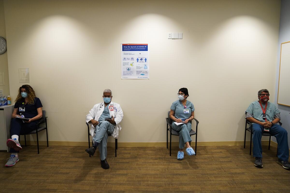 Medical staff wait for doses of the COVID-19 vaccine at the Kaiser Permanente Los Angeles Medical Center in Hollywood 