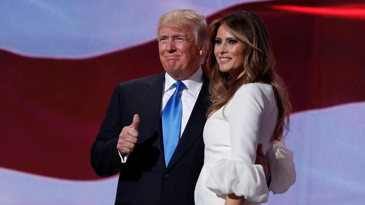 Republican presidential candidate Donald Trump stands with his wife, Melania, at the Republican National Convention. Her speech included phrases spoken by Michelle Obama in a 2008 address.