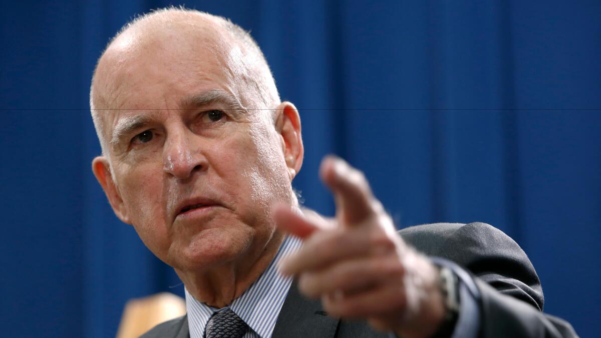 Gov. Jerry Brown discusses the state budget during a news conference in May. On Monday, Brown approved the state's spending plan, which boosts the state's reserves and increases funding for state-subsidized child care.