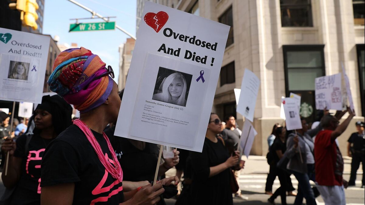 Drug reform advocates, former addicts and family members who have lost loved ones march in New York. A new report says drug overdose deaths among American women have more than tripled since 1999.