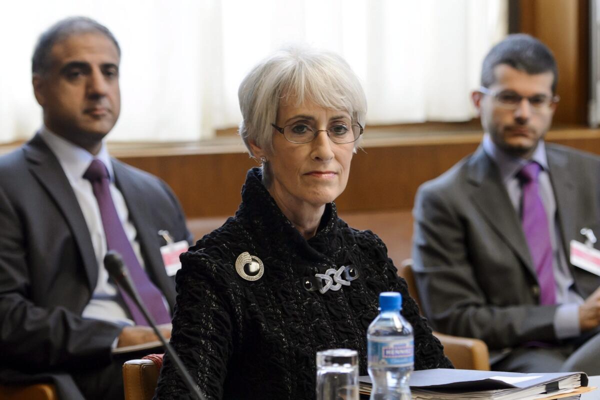 In Geneva, U.S. Undersecretary of State Wendy Sherman waits for the start of a round of talks on Iran's nuclear program.
