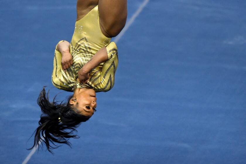 UCLA's Nia Dennis performs her floor routine against Brigham Young at Pauley Pavilion on Feb. 10, 2021.