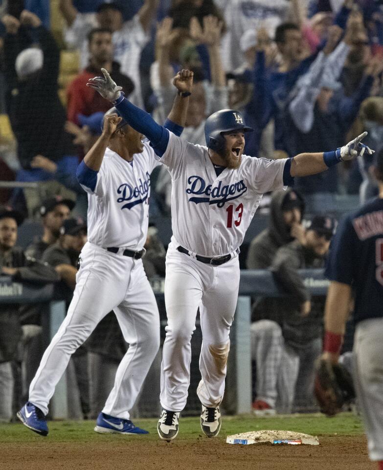 Dodgers first baseman Max Muncy reacts after hitting the game winning homer off Boston Red Sox pitcher Nathan Eovaldi in the 18th inning.