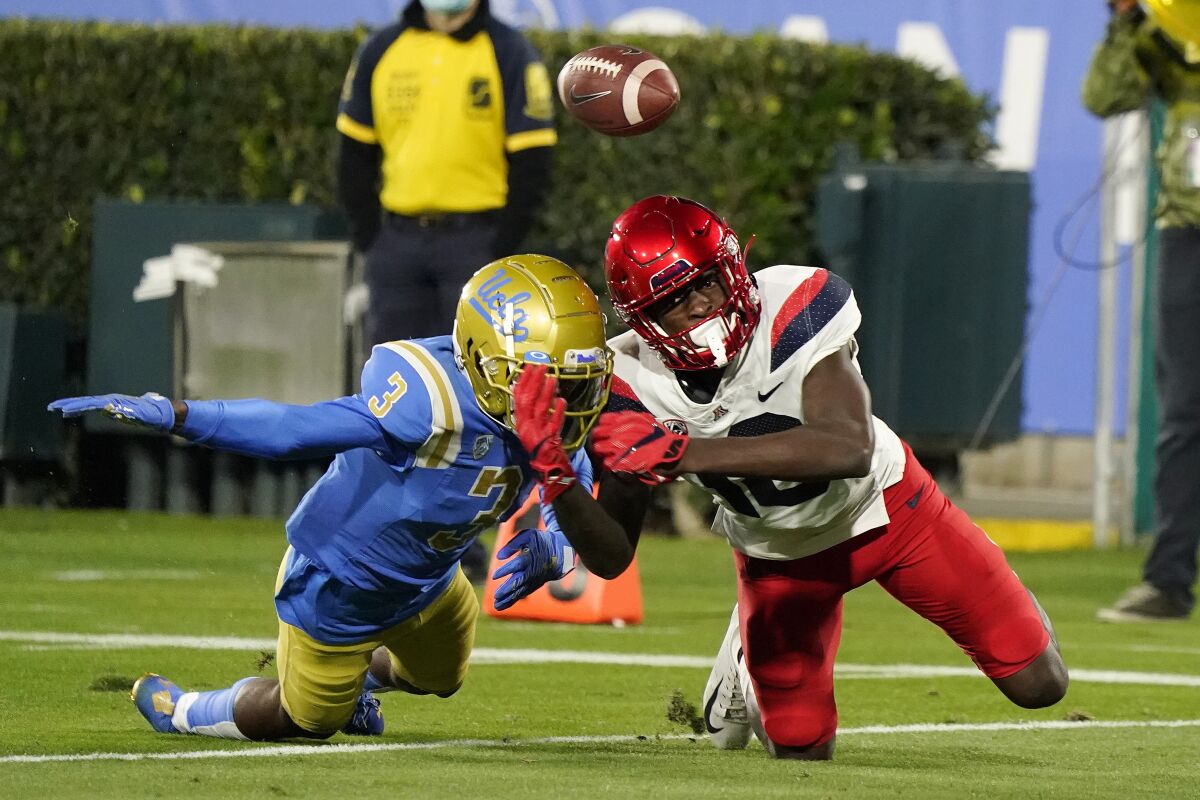 UCLA defensive back Rayshad Williams breaks up a pass intended for Arizona wide receiver Jamarye Joiner on Nov. 28, 2020.