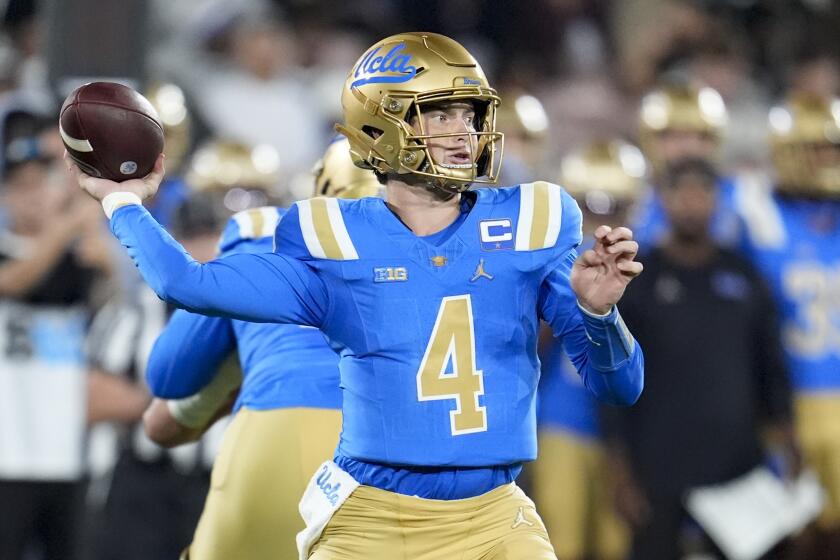 UCLA quarterback Ethan Garbers throws a pass during the first half of an NCAA college football.