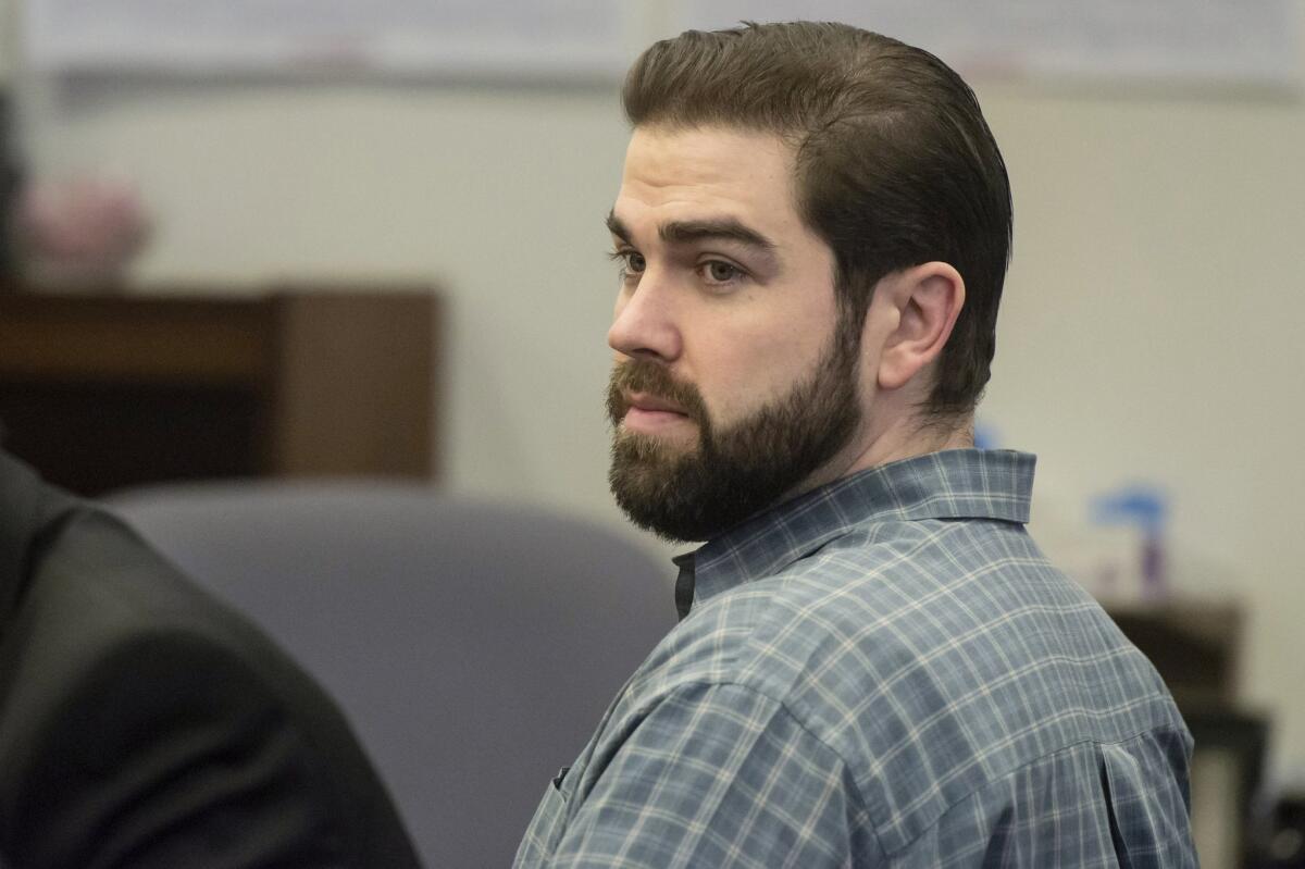 In this Dec. 9, 2015 photo, Daniel Wozniak sits in court as opening statements began in his murder trial in Santa Ana.
