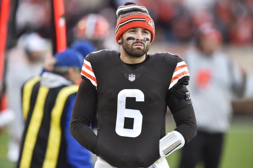 Cleveland Browns quarterback Baker Mayfield watches during the second half of an NFL football game against the Baltimore Ravens, Sunday, Dec. 12, 2021, in Cleveland. (AP Photo/David Richard)