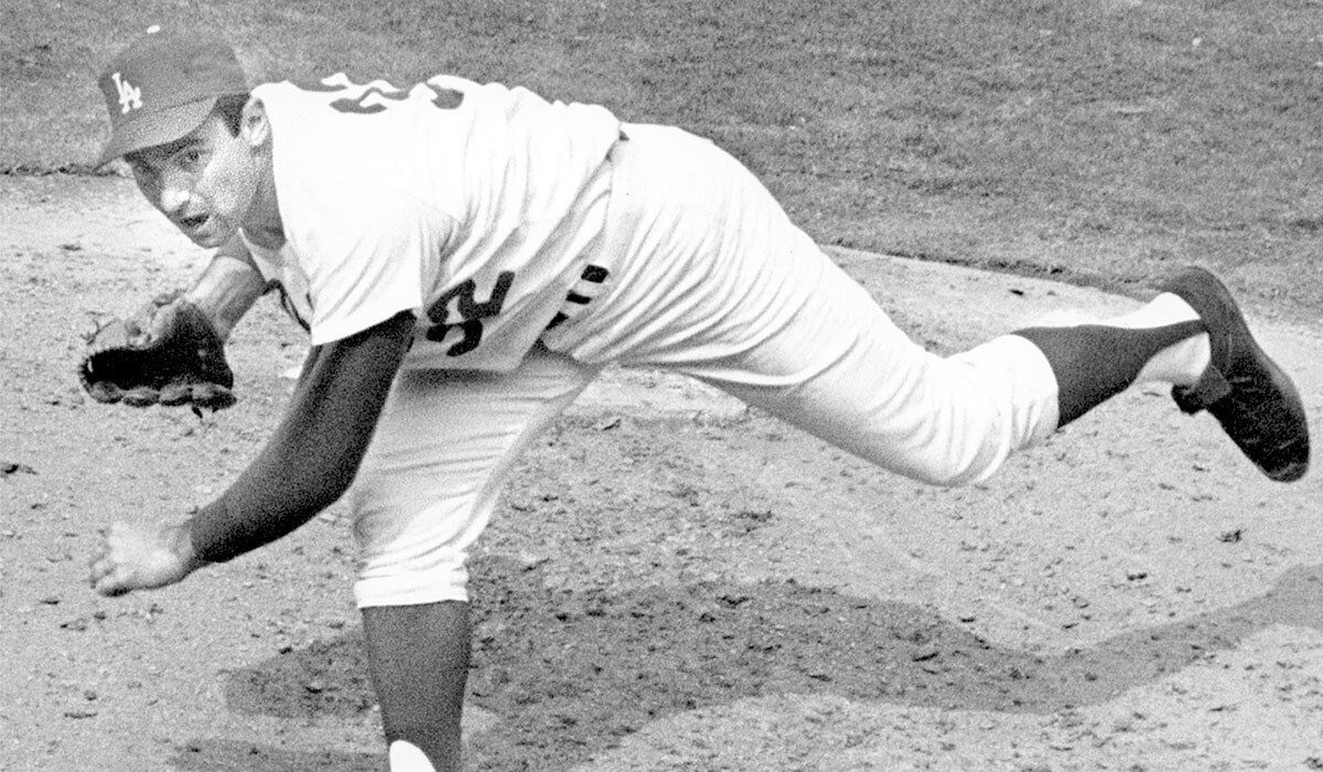 Sandy Koufax pitches in 1965, the year he started and won Game 7 of the World Series on two days' rest.