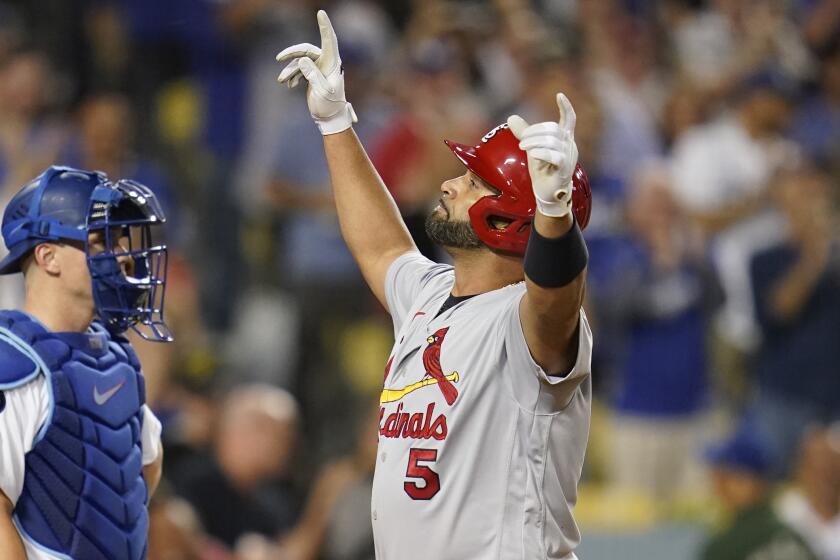 Albert Pujols joins 700 home run club in defiant final season - Sports  Illustrated