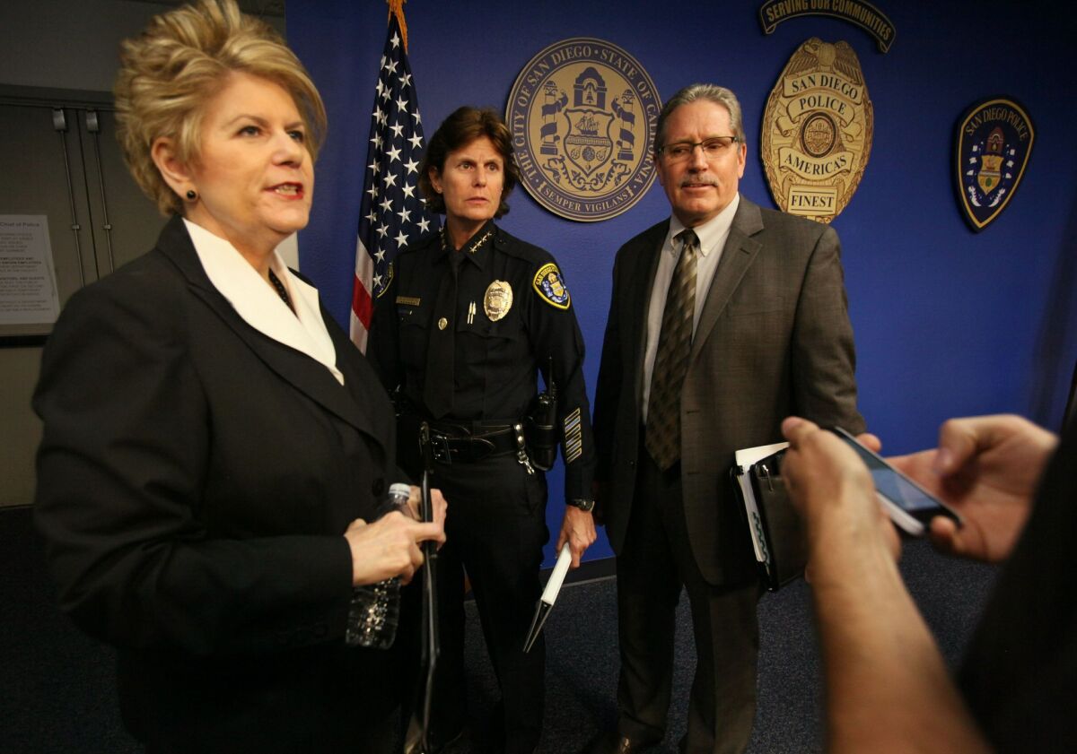 After the press conference announcing an arrest in 14 year-old cold case involving the disappearance of two-year-old Jahi Turner, District Attorney Bonnie Dumanis, left, SDPD Chief Sheley Zimmerman and Deputy DA Bill Mitchell answer a reporter's questions. — Peggy Peattie / San Diego Union-Tribune