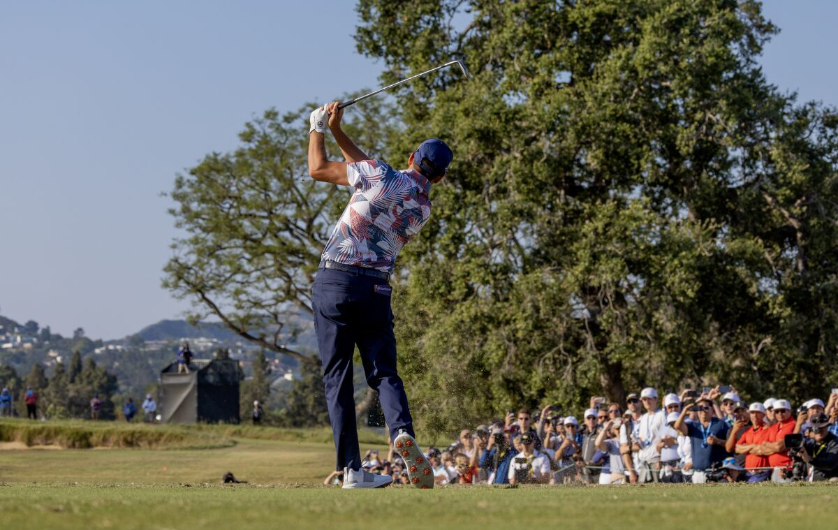 Rickie Fowler hits his tee shot on the par-three 15th hole during the second round June 16, 2023.