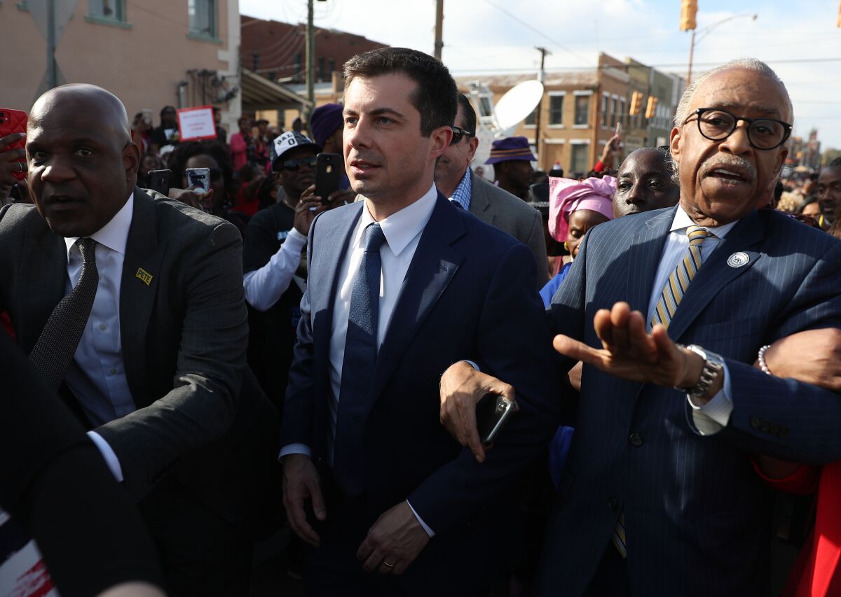 Buttigieg and the Rev. Al Sharpton participate in the Edmund Pettus Bridge crossing reenactment