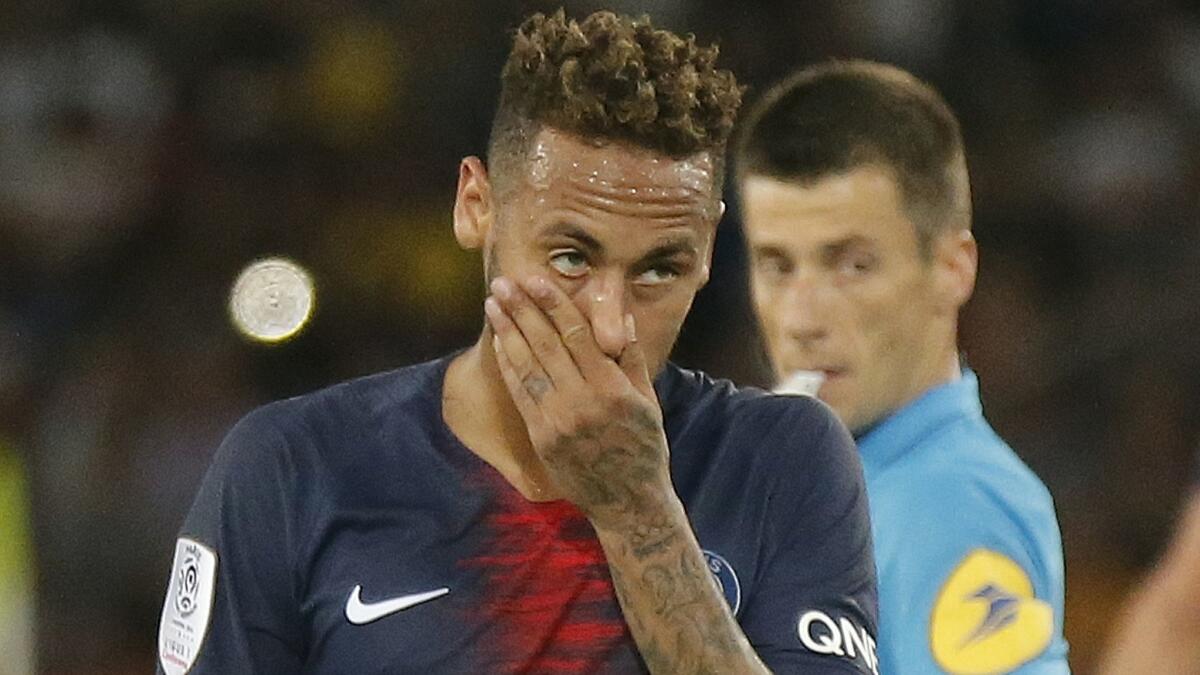 Paris Saint-Germain striker Neymar, shown in 2018, has been given a three-game ban for lashing out at a fan following a loss in the French Cup final last month.