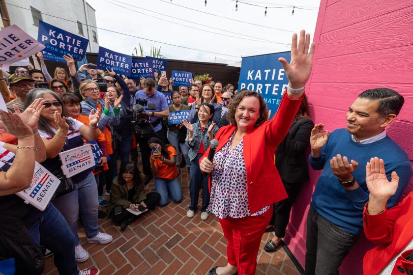 Long Beach, CA - February 17: Rep. Katie Porter, who is running for the late Dianne Feinstein's Senate seat, waves to supporters at a campaign event at Lola's Mexican Cuisine on Saturday, Feb. 17, 2024 in Long Beach, CA. (Brian van der Brug / Los Angeles Times)